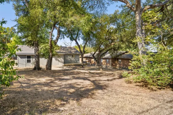 a house with trees in front of it