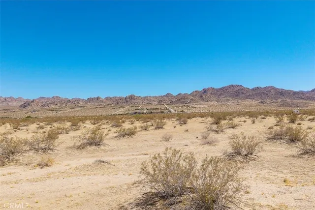 a view of mountain and an ocean
