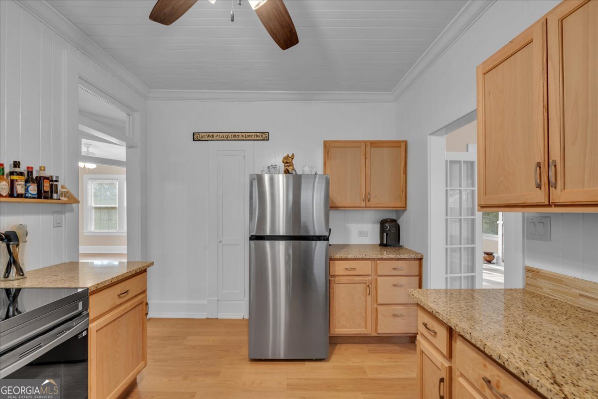 425 3rd Street Vienna, GA 31092 - Photo 13 of 40 a kitchen with appliances cabinets and a sink