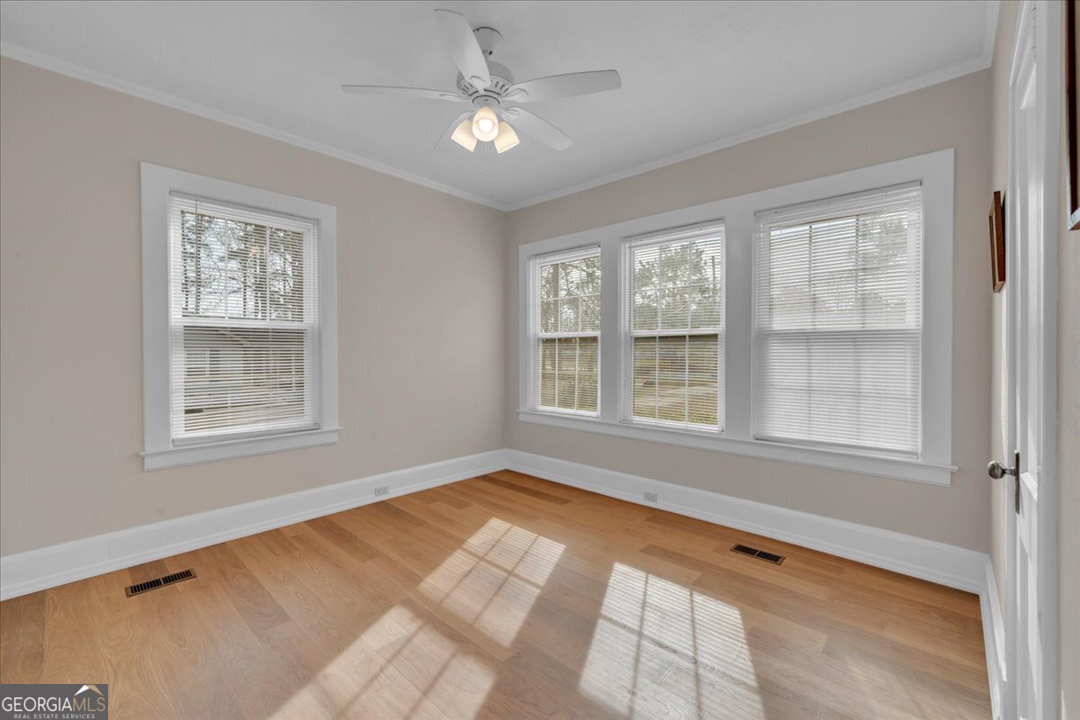 425 3rd Street Vienna, GA 31092 - Photo 17 of 40 a view of an empty room with a window