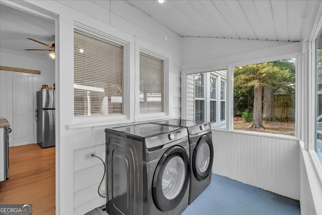 a utility room with dryer and washer