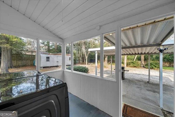 a kitchen with a large window and a counter top