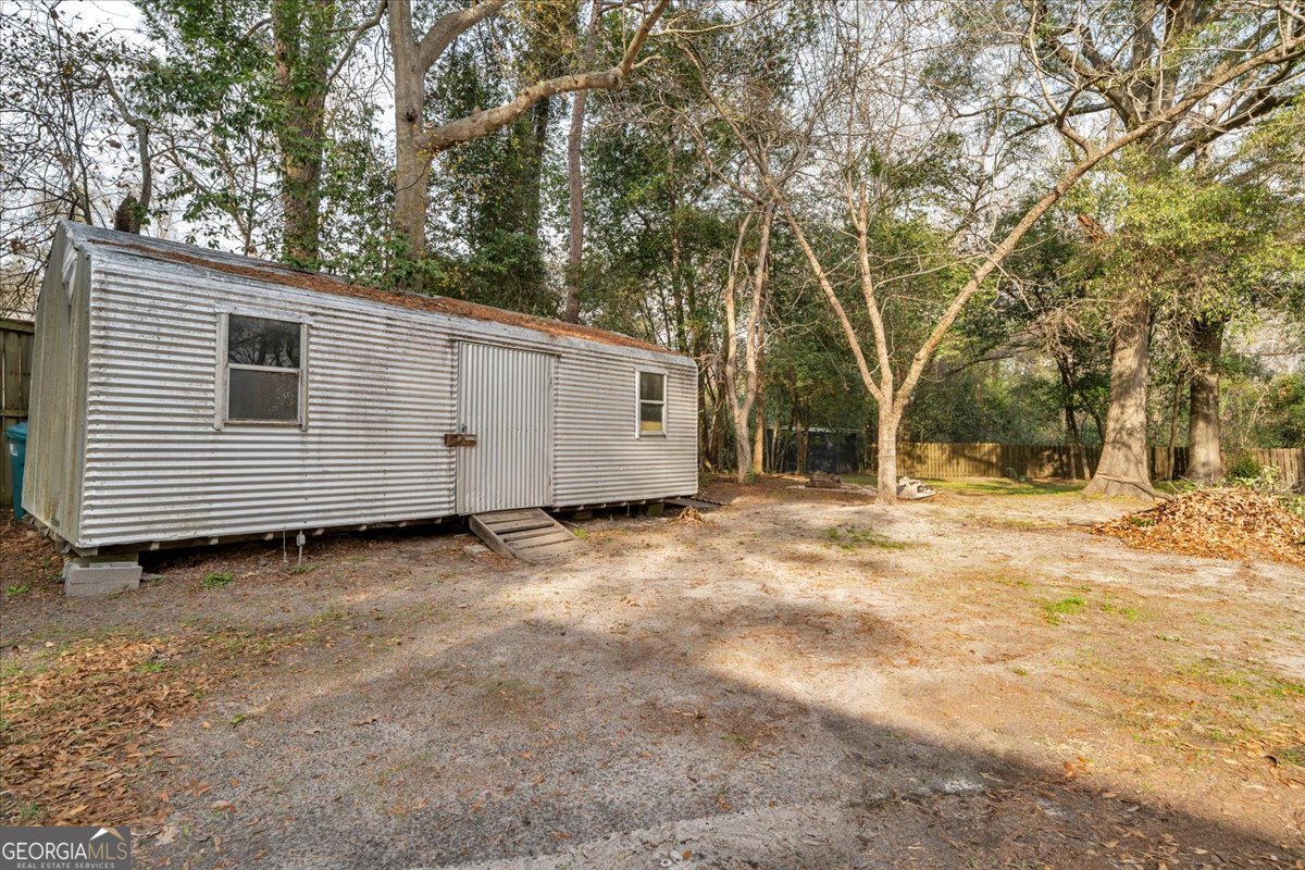 425 3rd Street Vienna, GA 31092 - Photo 27 of 40 a view of a barn house with a large window