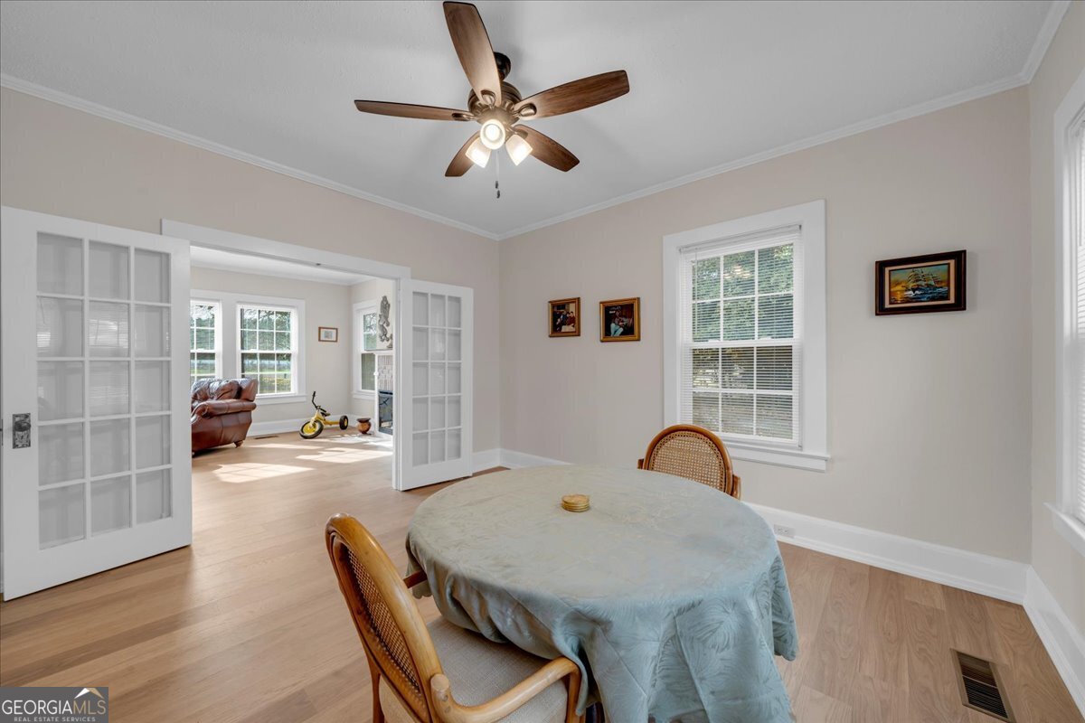 425 3rd Street Vienna, GA 31092 - Photo 8 of 40 a dining room with furniture and window