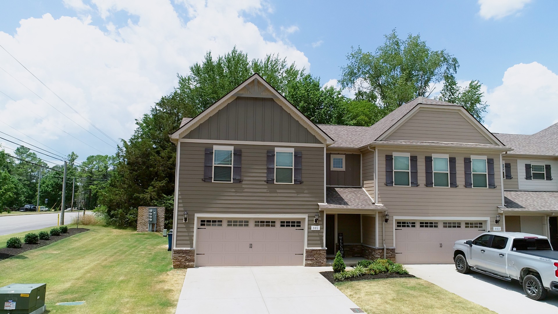 a front view of a house with a yard