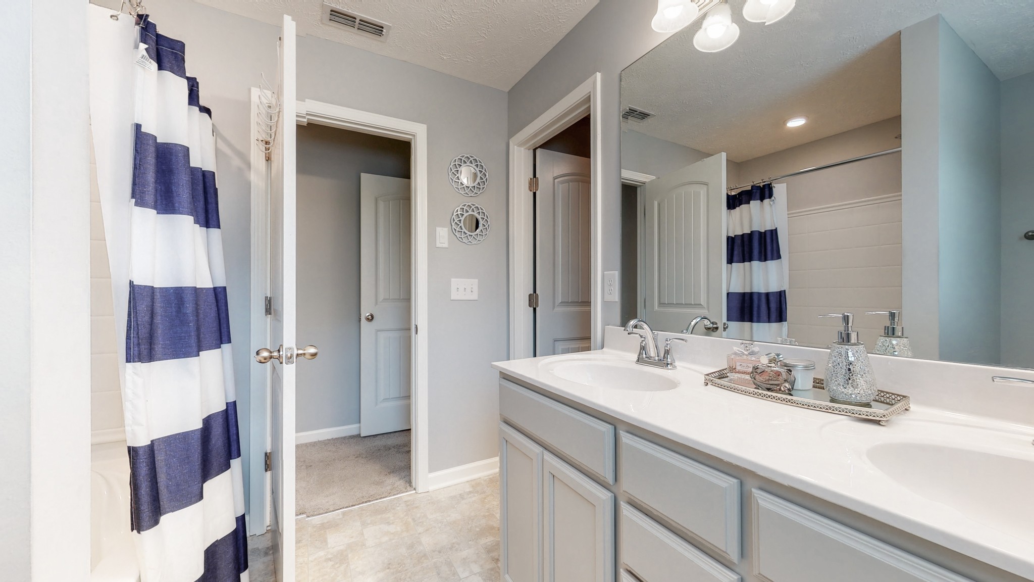 301 Homer Jackson Drive Smyrna, TN 37167 - Photo 16 of 27 a bathroom with a double vanity sink mirror and shower