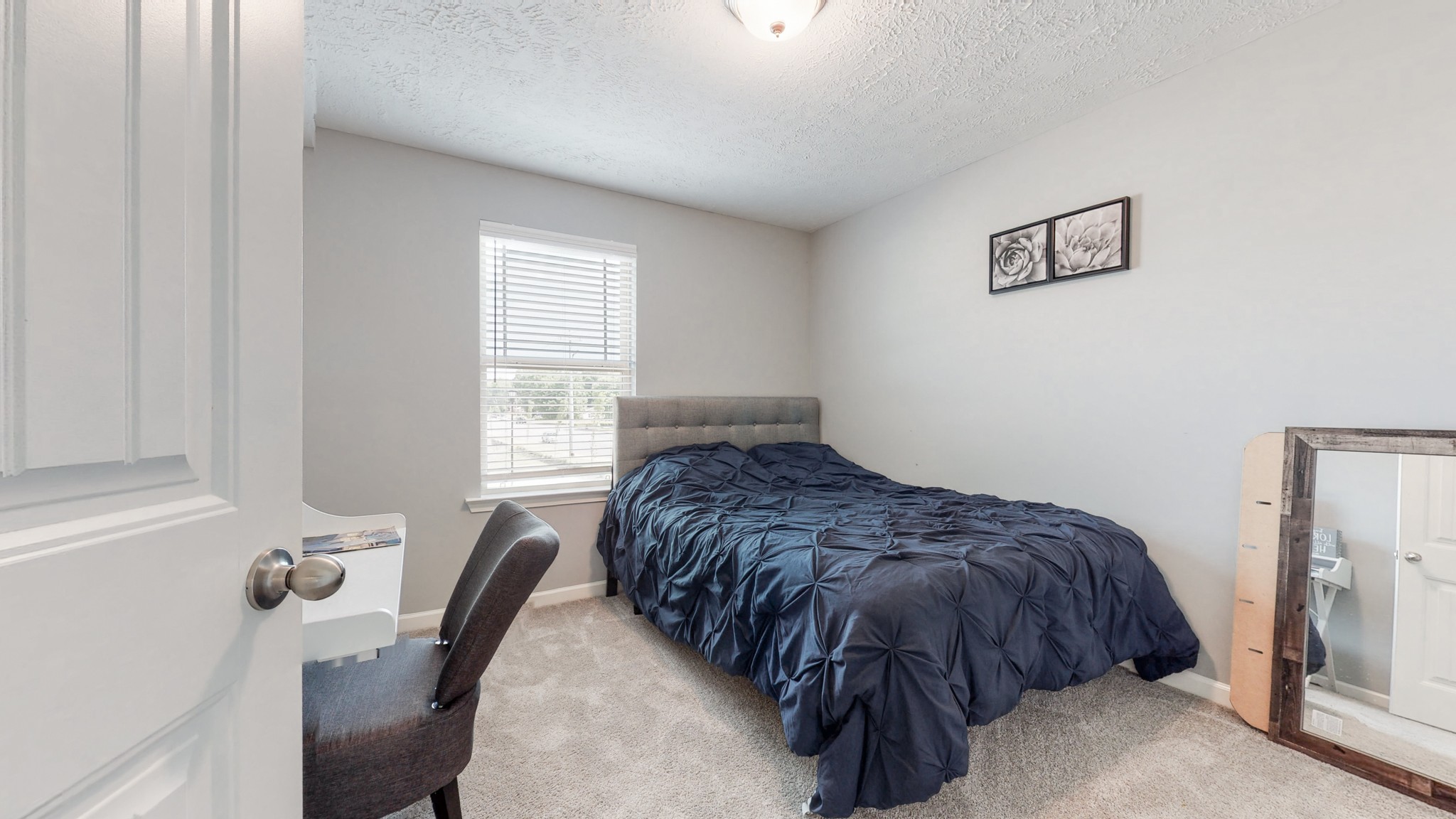 301 Homer Jackson Drive Smyrna, TN 37167 - Photo 18 of 27 a bedroom with a bed and window