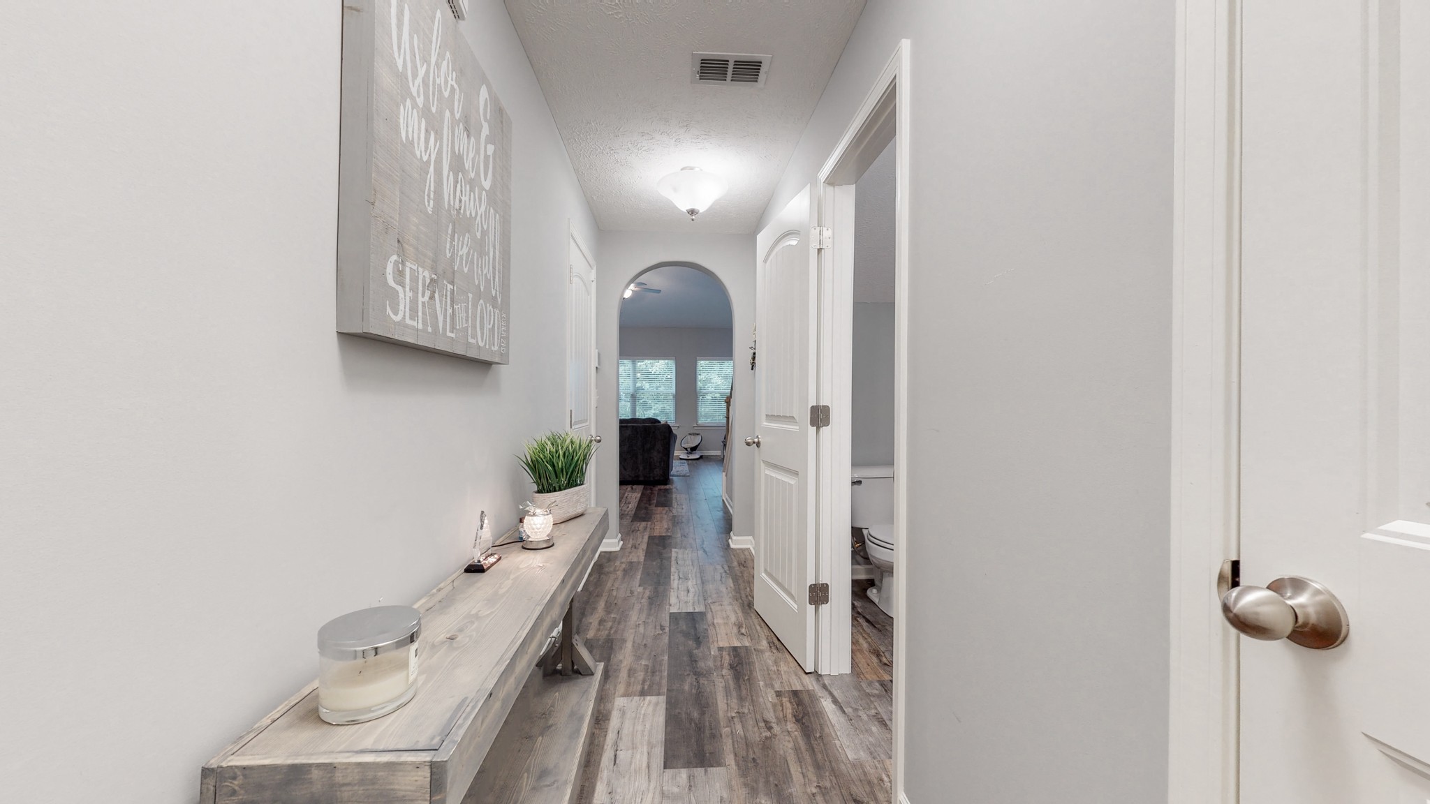 301 Homer Jackson Drive Smyrna, TN 37167 - Photo 4 of 27 a view of a hallway with wooden floor and a bathroom