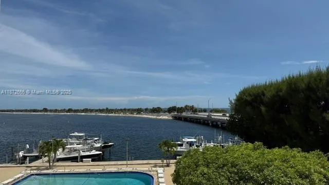 an aerial view of a house with a garden and lake view