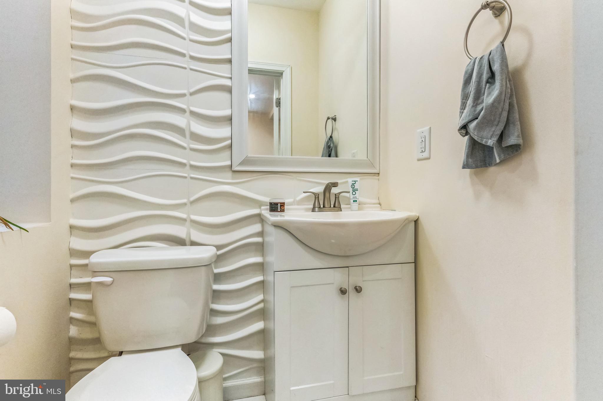 2233 Moore Street Philadelphia, PA 19145 - Photo 11 of 24 a bathroom with a sink toilet and mirror