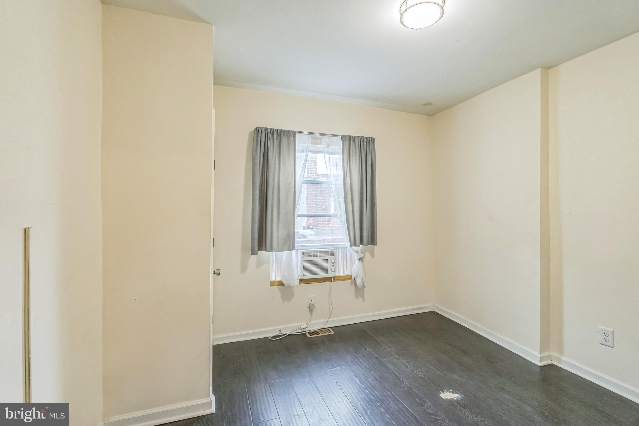 2233 Moore Street Philadelphia, PA 19145 - Photo 15 of 24 an empty room with wooden floor and windows