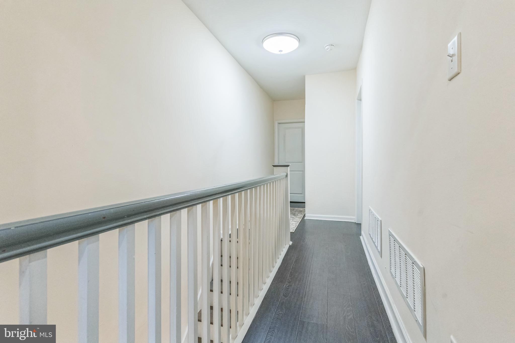 2233 Moore Street Philadelphia, PA 19145 - Photo 19 of 24 a view of a hallway with wooden floor