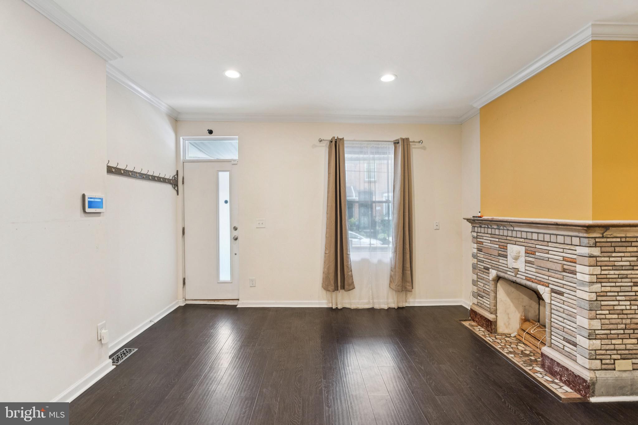 2233 Moore Street Philadelphia, PA 19145 - Photo 4 of 24 an empty room with wooden floor and windows