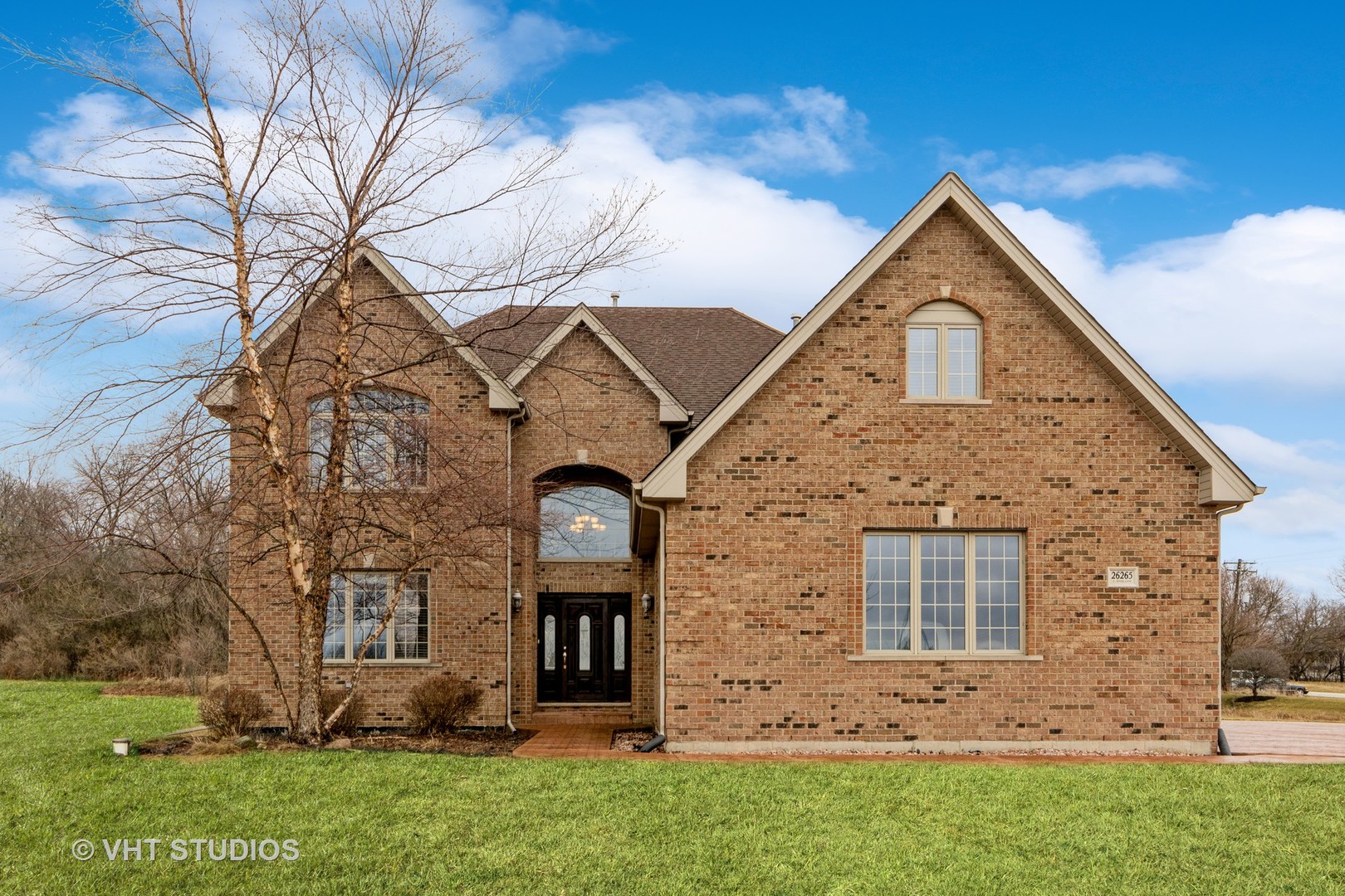 26265 South Sandy Lane Monee, IL 60449 - Photo 1 of 3 a front view of a house with a garden