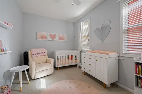 a bedroom with furniture and a window