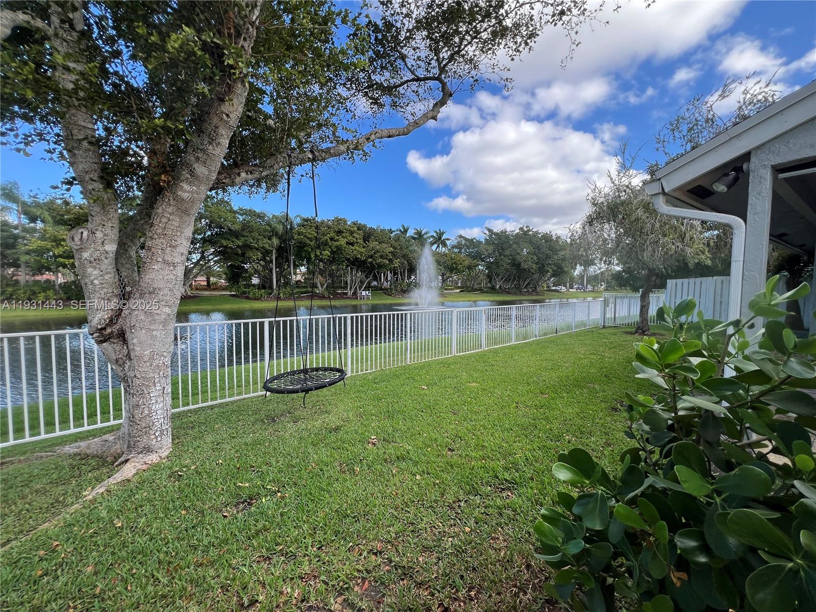 13721 Newport Manor Davie, FL 33325 - Photo 2 of 16 a view of a garden with a slide