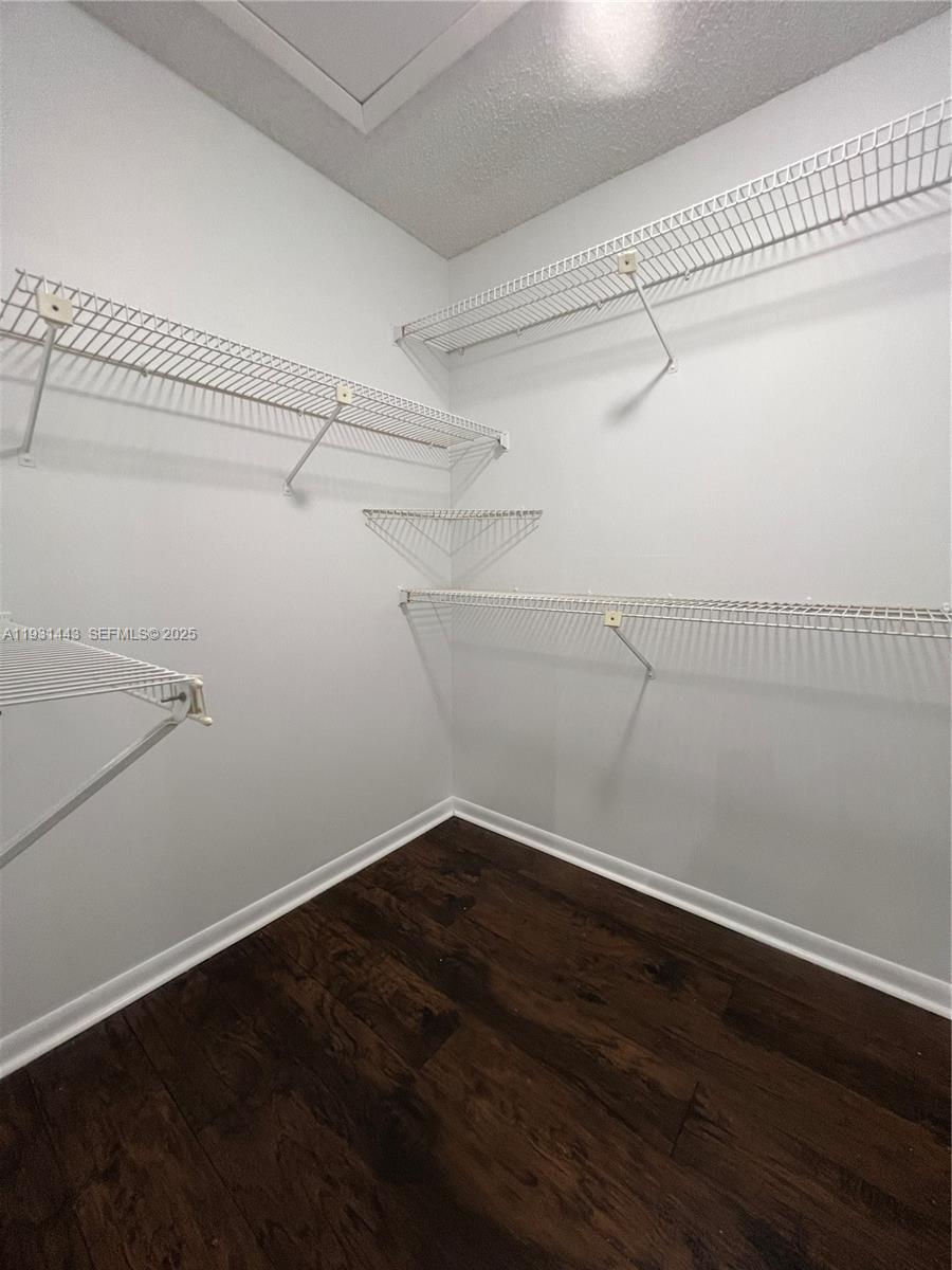 13721 Newport Manor Davie, FL 33325 - Photo 4 of 16 a view of a room with racks on the wall