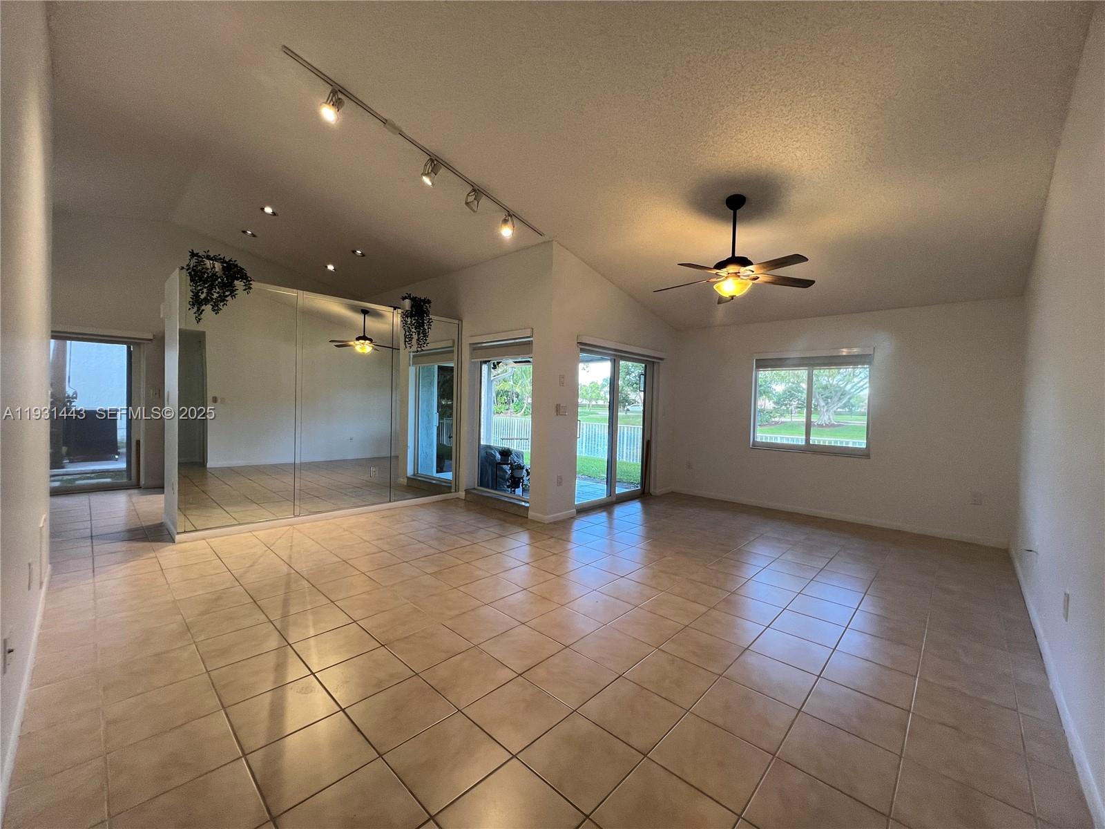 13721 Newport Manor Davie, FL 33325 - Photo 9 of 16 a view of an empty room with a window