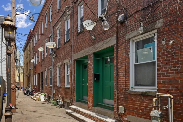 a view of a brick building with many windows