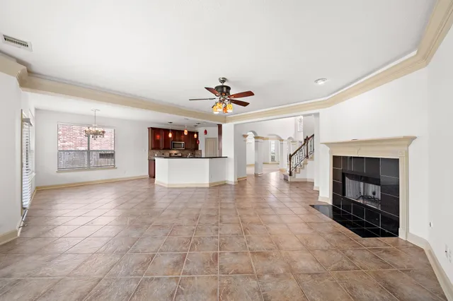 a large kitchen with stainless steel appliances granite countertop a stove and a sink with cabinets