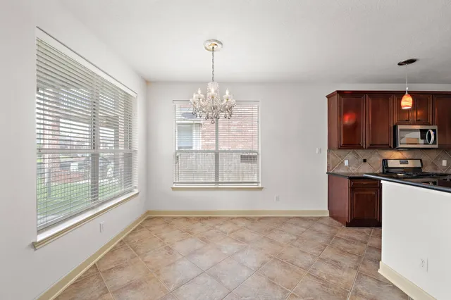 a view of a kitchen with a sink and cabinets