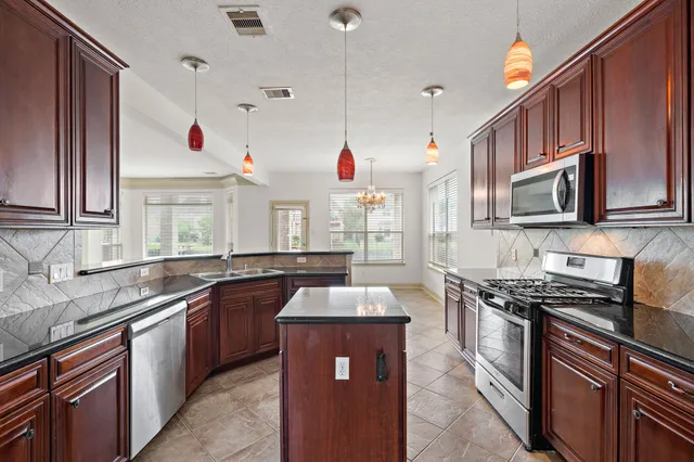 a bathroom with a sink toilet and mirror