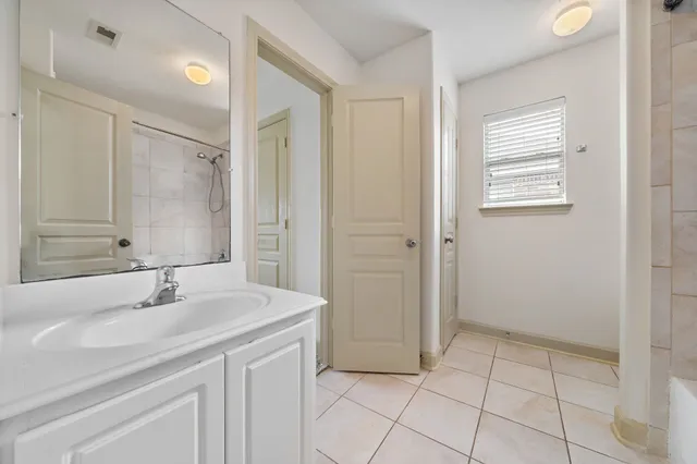 an empty room with a empty space and windows