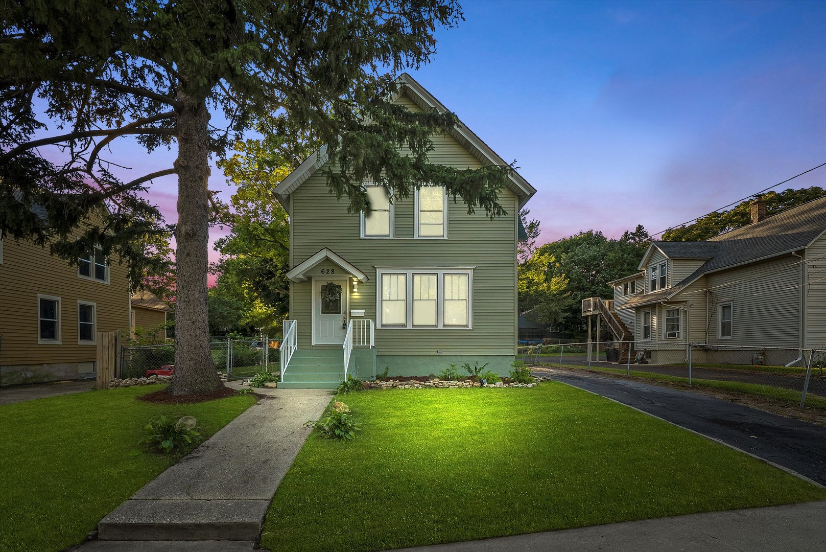front view of a house with a yard