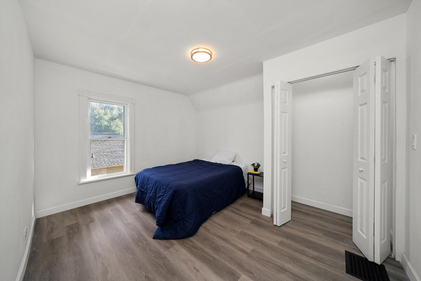 628 South Liberty Street Elgin, IL 60120 - Photo 12 of 22 a room with a window and wooden floor