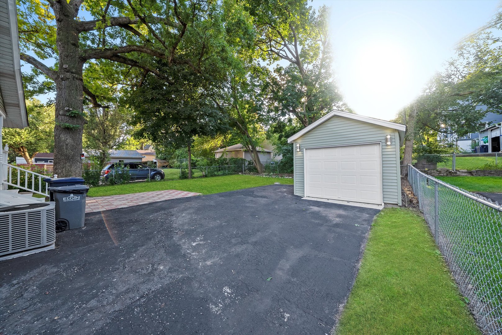 628 South Liberty Street Elgin, IL 60120 - Photo 15 of 22 a view of a house with a yard and garage