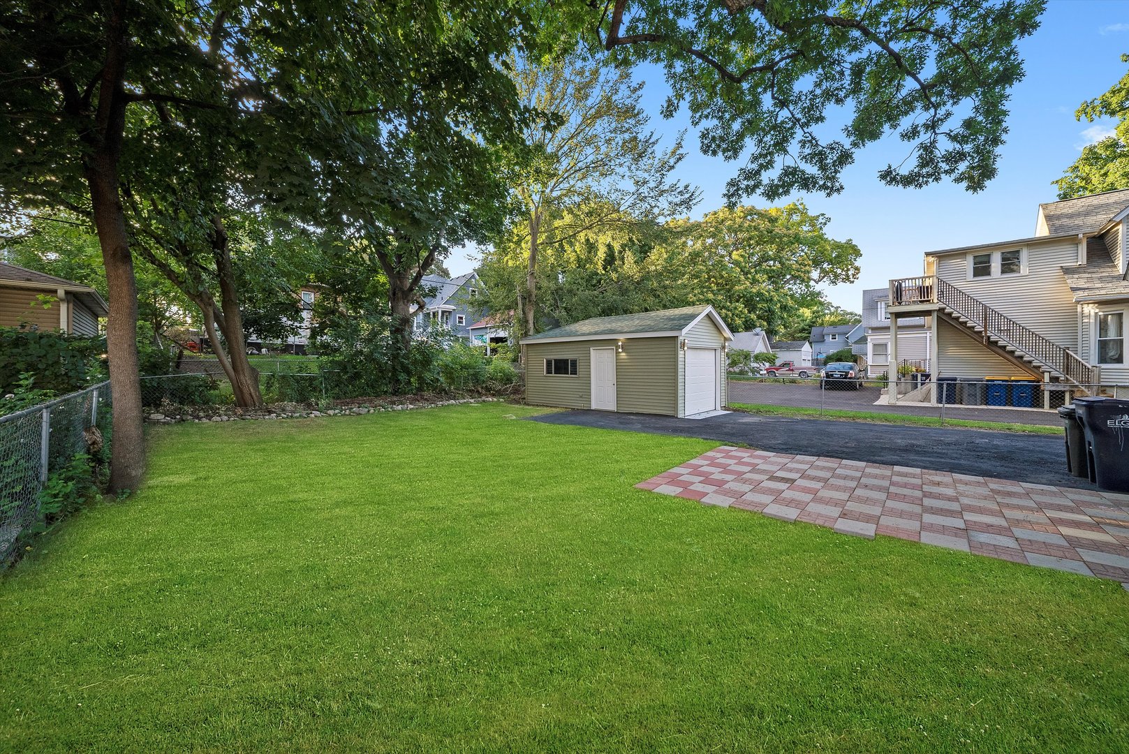 628 South Liberty Street Elgin, IL 60120 - Photo 16 of 22 a front view of a house with a yard
