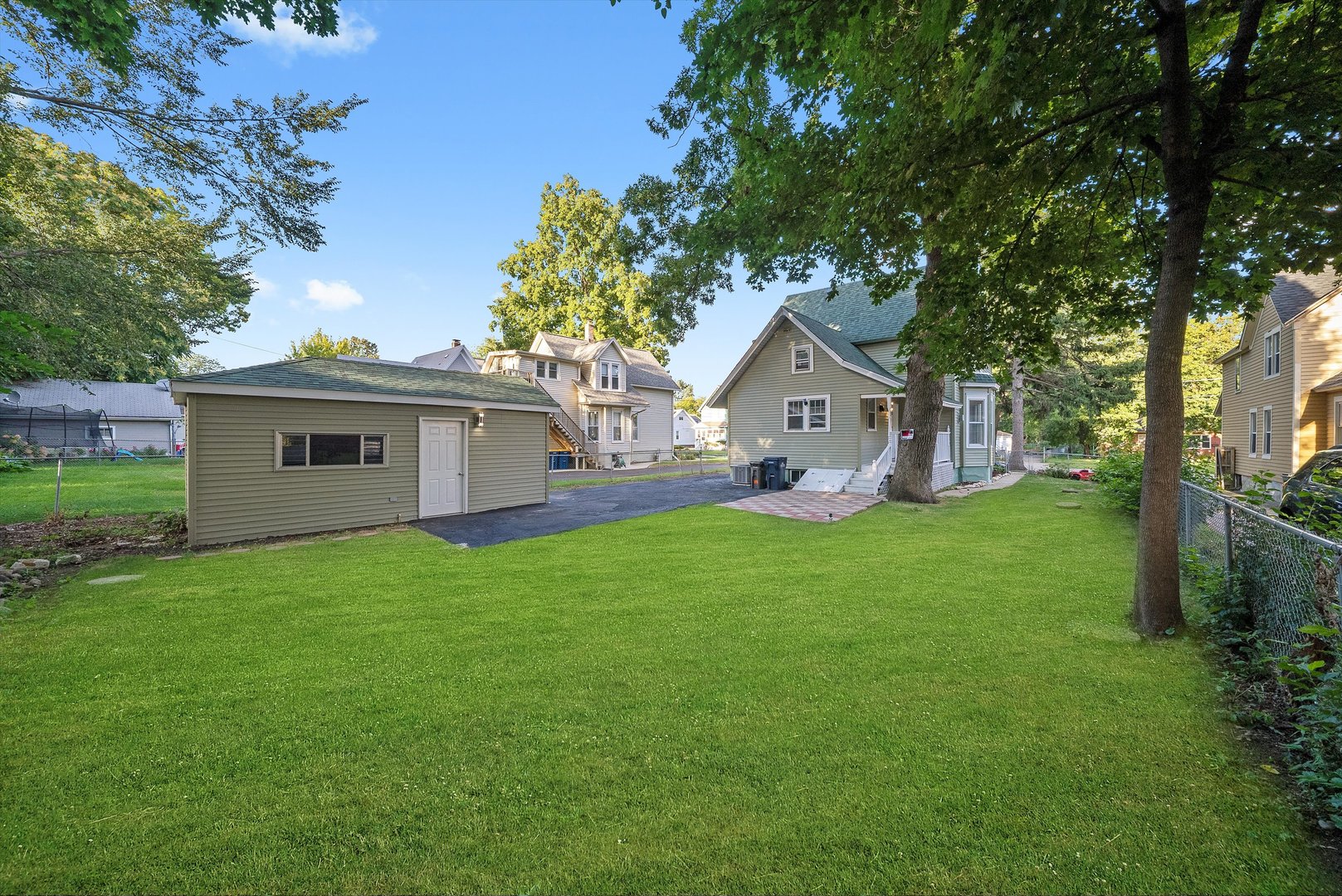 628 South Liberty Street Elgin, IL 60120 - Photo 17 of 22 a front view of a house with yard and green space