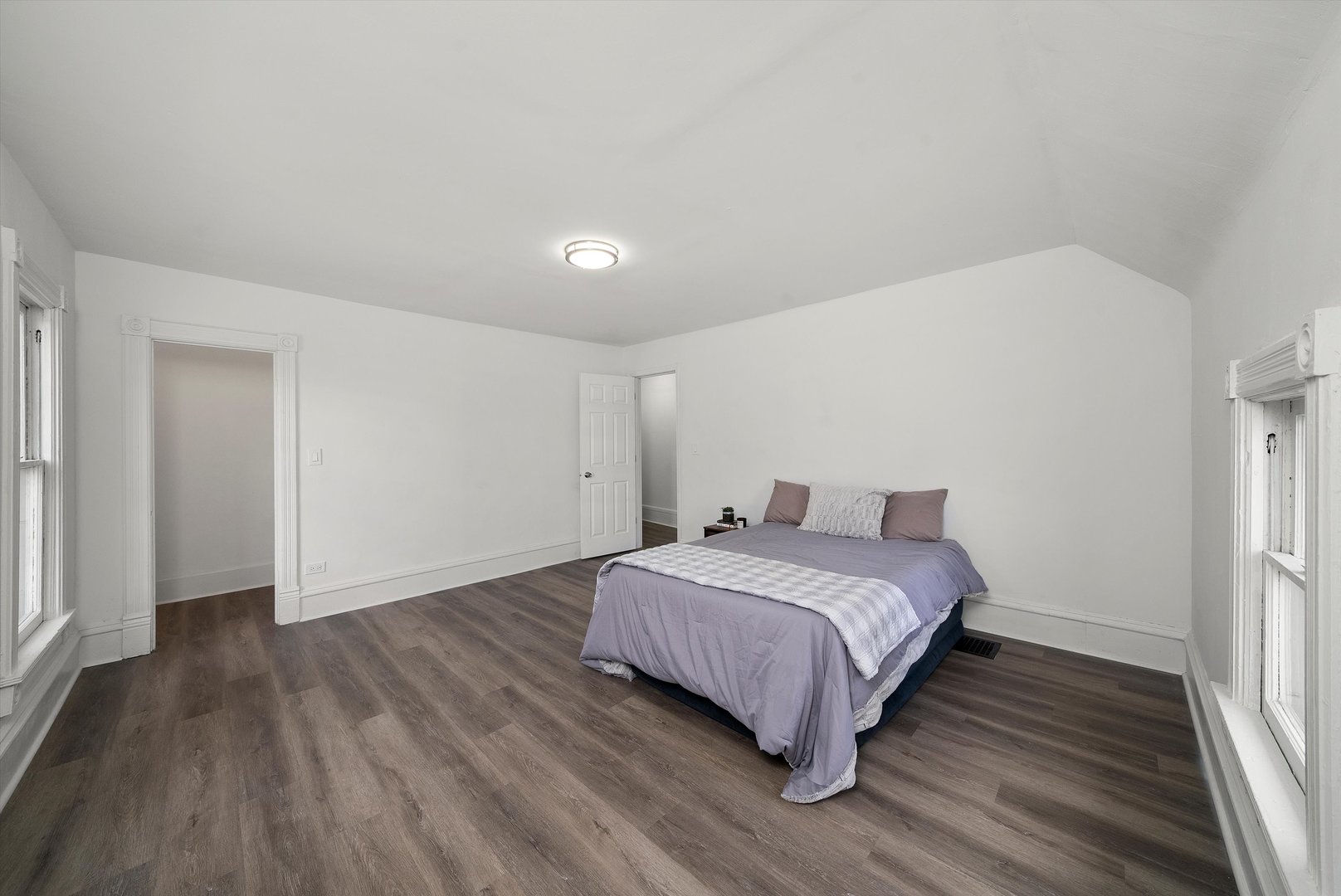 628 South Liberty Street Elgin, IL 60120 - Photo 10 of 22 a bedroom with a bed and wooden floor