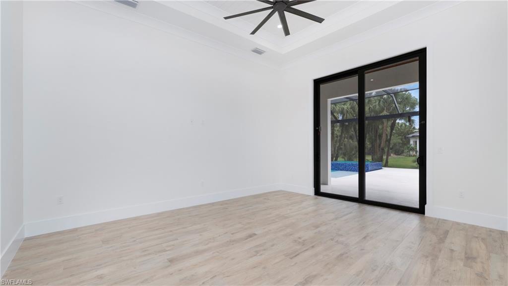 652 15th Street Southwest Naples, FL 34117 - Photo 22 of 47 wooden floor in an empty room
