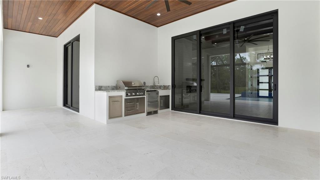 652 15th Street Southwest Naples, FL 34117 - Photo 29 of 47 a view of an empty room with a cabinet