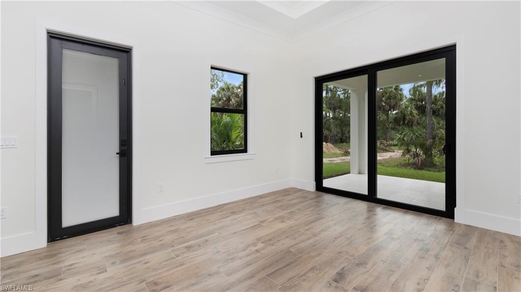 652 15th Street Southwest Naples, FL 34117 - Photo 38 of 47 a view of an empty room with glass door and balcony