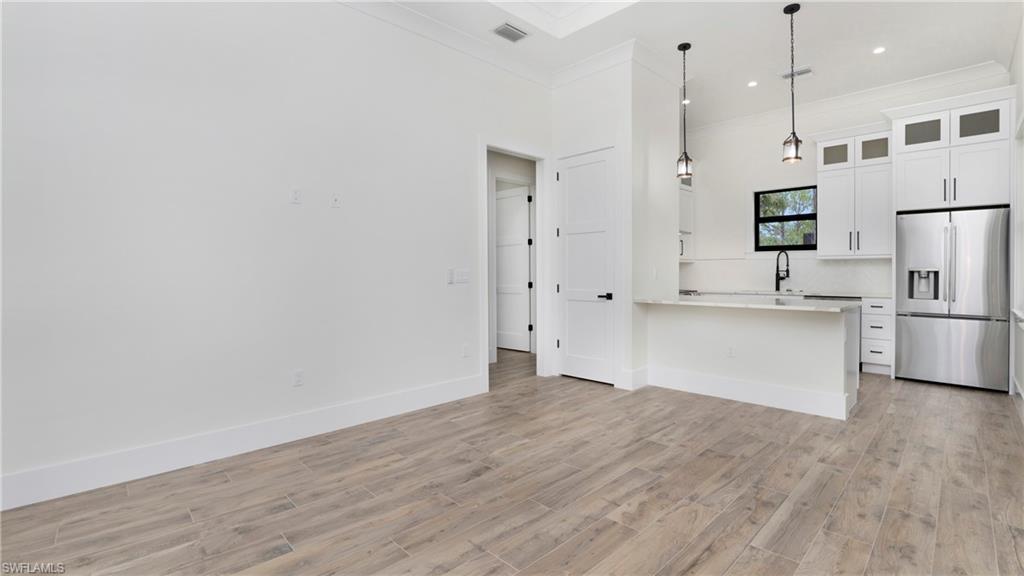 652 15th Street Southwest Naples, FL 34117 - Photo 39 of 47 a view of kitchen with wooden floor