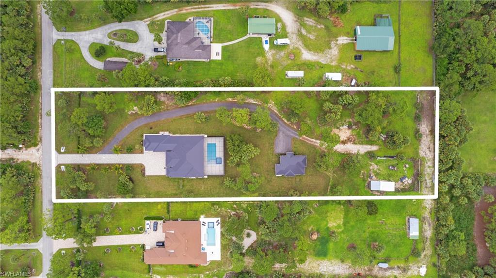 652 15th Street Southwest Naples, FL 34117 - Photo 45 of 47 view of an outdoor space and a lake view