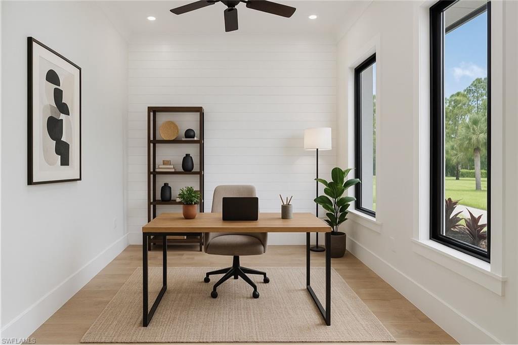 652 15th Street Southwest Naples, FL 34117 - Photo 5 of 47 a view of a workspace with furniture and a window