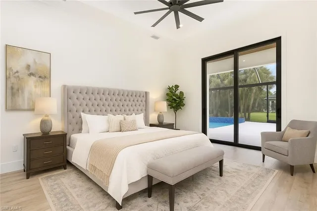 a view of a living room kitchen and a refrigerator