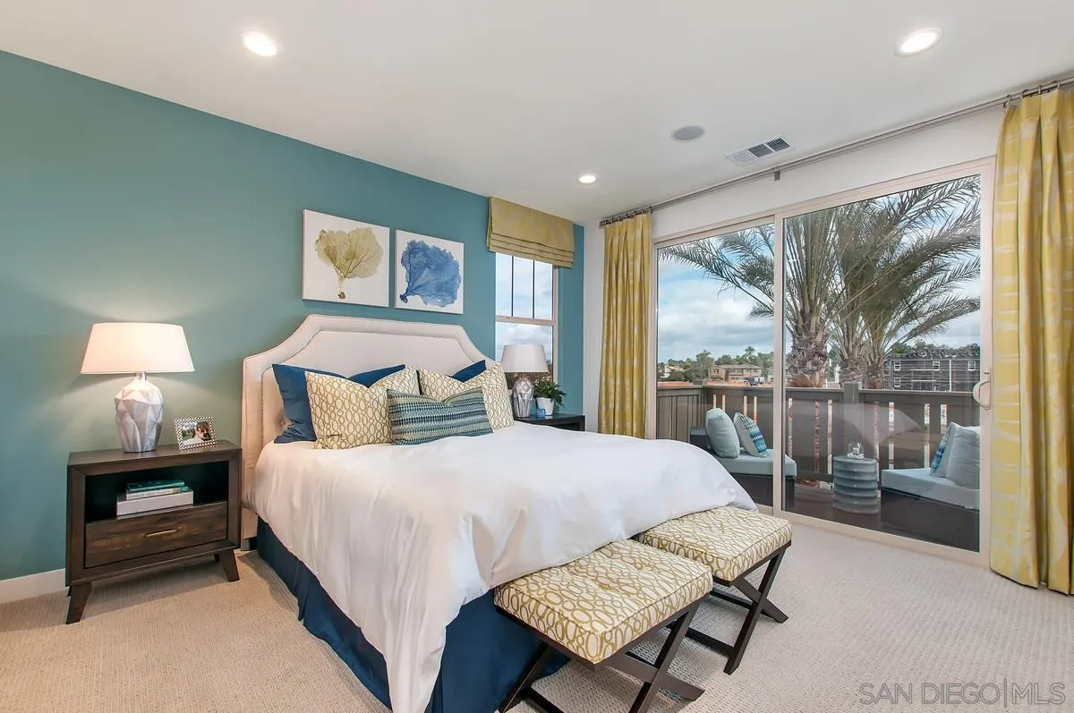 1189 Via Candelas Oceanside, CA 92056 - Photo 11 of 21 a bedroom with a bed and wooden floor