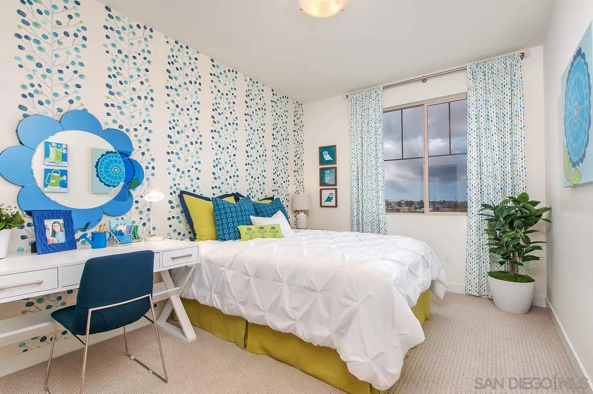 1189 Via Candelas Oceanside, CA 92056 - Photo 19 of 21 a bedroom with a bed and a chair