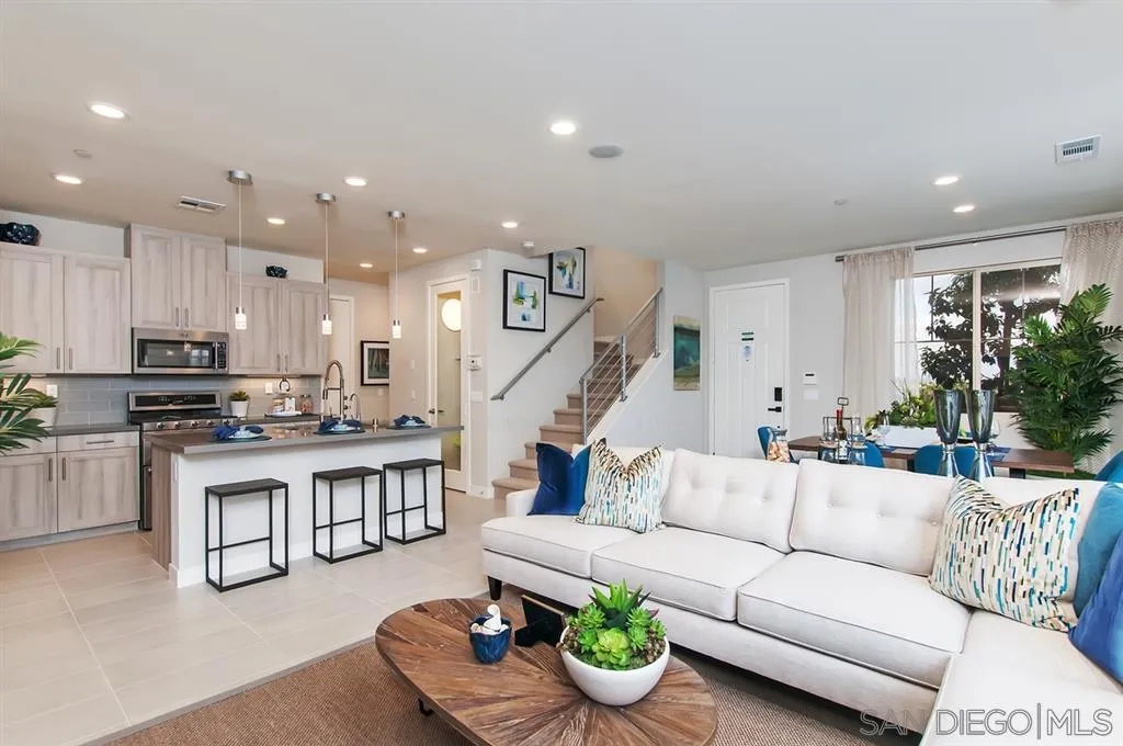1189 Via Candelas Oceanside, CA 92056 - Photo 4 of 21 a living room with furniture kitchen and a table