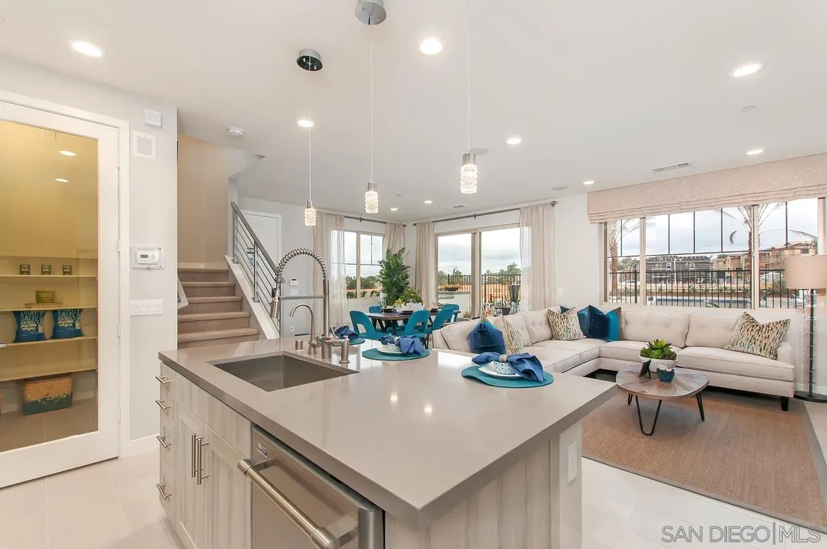 1189 Via Candelas Oceanside, CA 92056 - Photo 5 of 21 a kitchen with large windows and living room