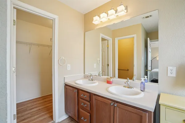 a view of a bathroom with a sink and a mirror