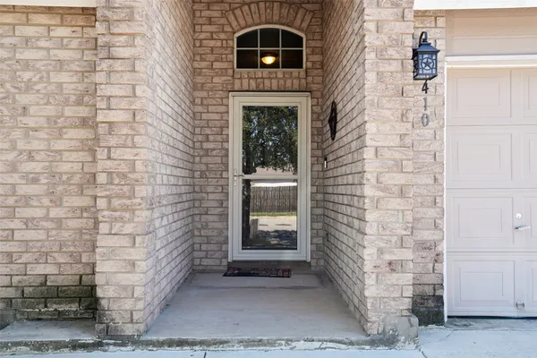 a brick building with a door and a window