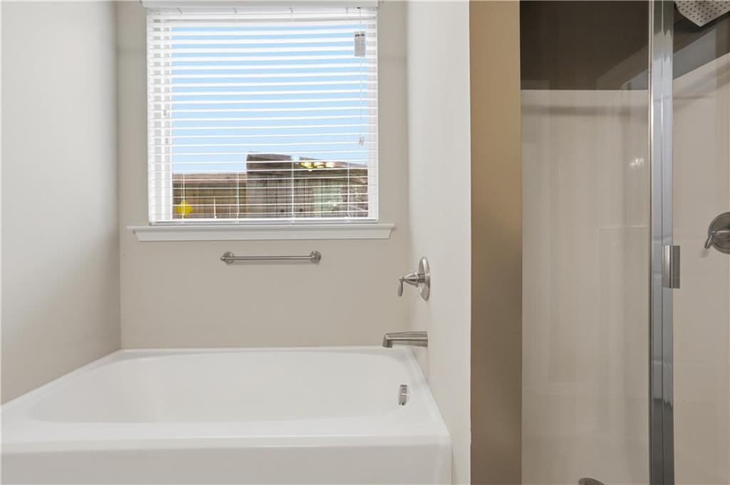 236 Manous Way Canton, GA 30115 - Photo 19 of 25 a white bath tub sitting next to a window