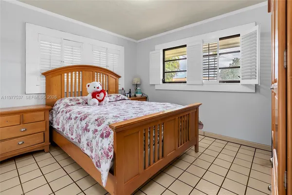 a room with a bed and a window