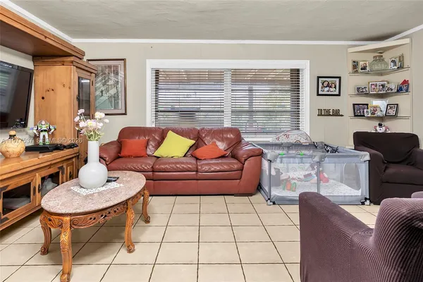 a living room with furniture and a rug