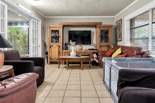 a living room with furniture and a flat screen tv